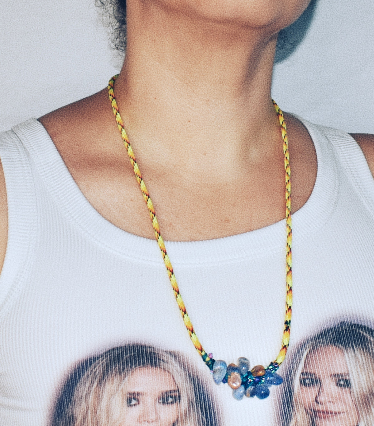 Adjustable blue chalcedony stone necklace worn long on neon yellow flecked paracord