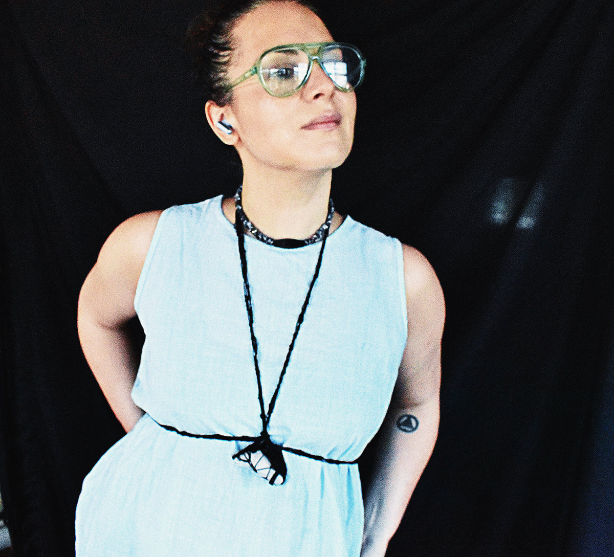 One-of-a-kind convertible black cord body harness with Tibetan quartz worn around the neck and waist