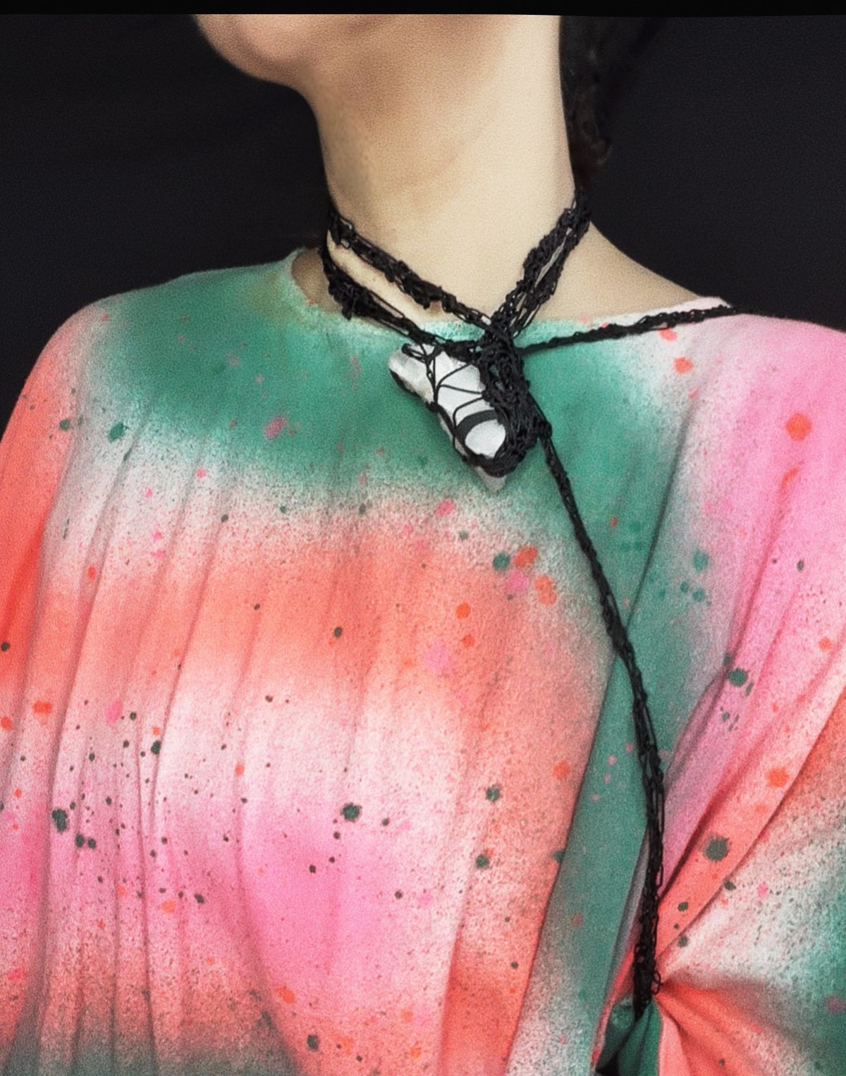 Convertible black crochet cord necklace worn as shoulder holster with harnessed Tibetan quartz centerpiece