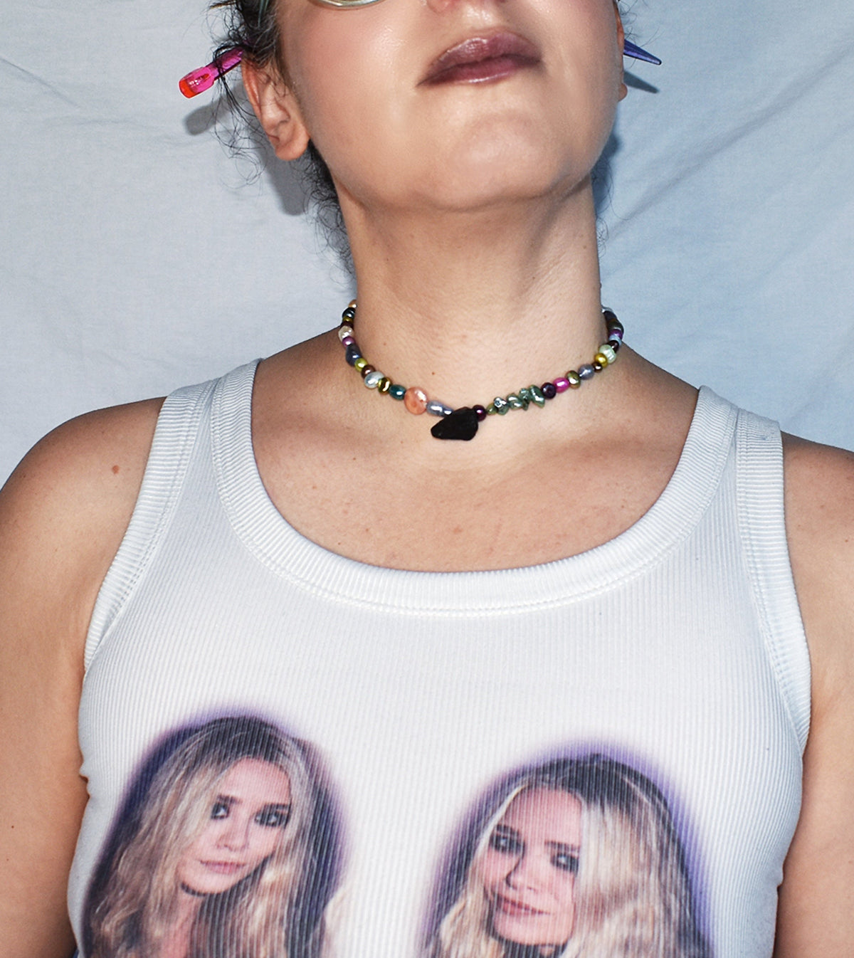Freshwater pearl and black tourmaline choker worn at the neck showing adjustable collar length